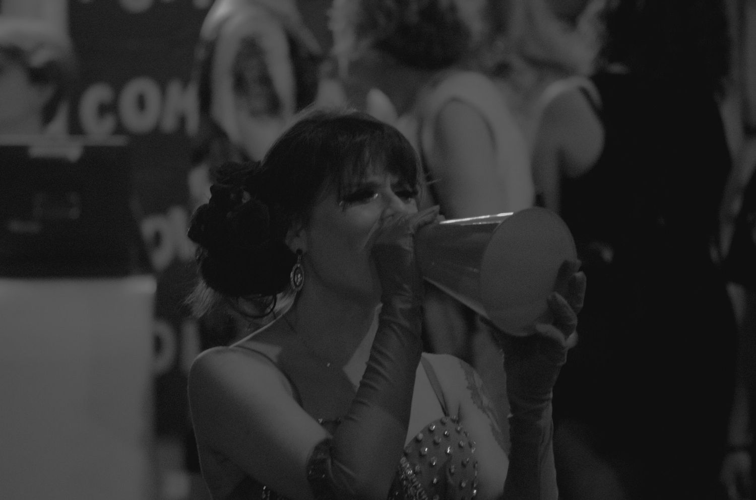 Crowd scene at a convention or event in black and white.