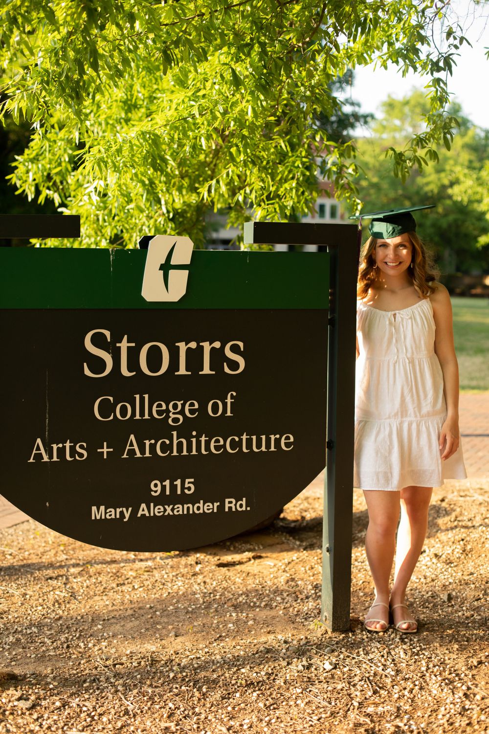 Storrs College of Arts + Architecture sign with graduate standing nearby.