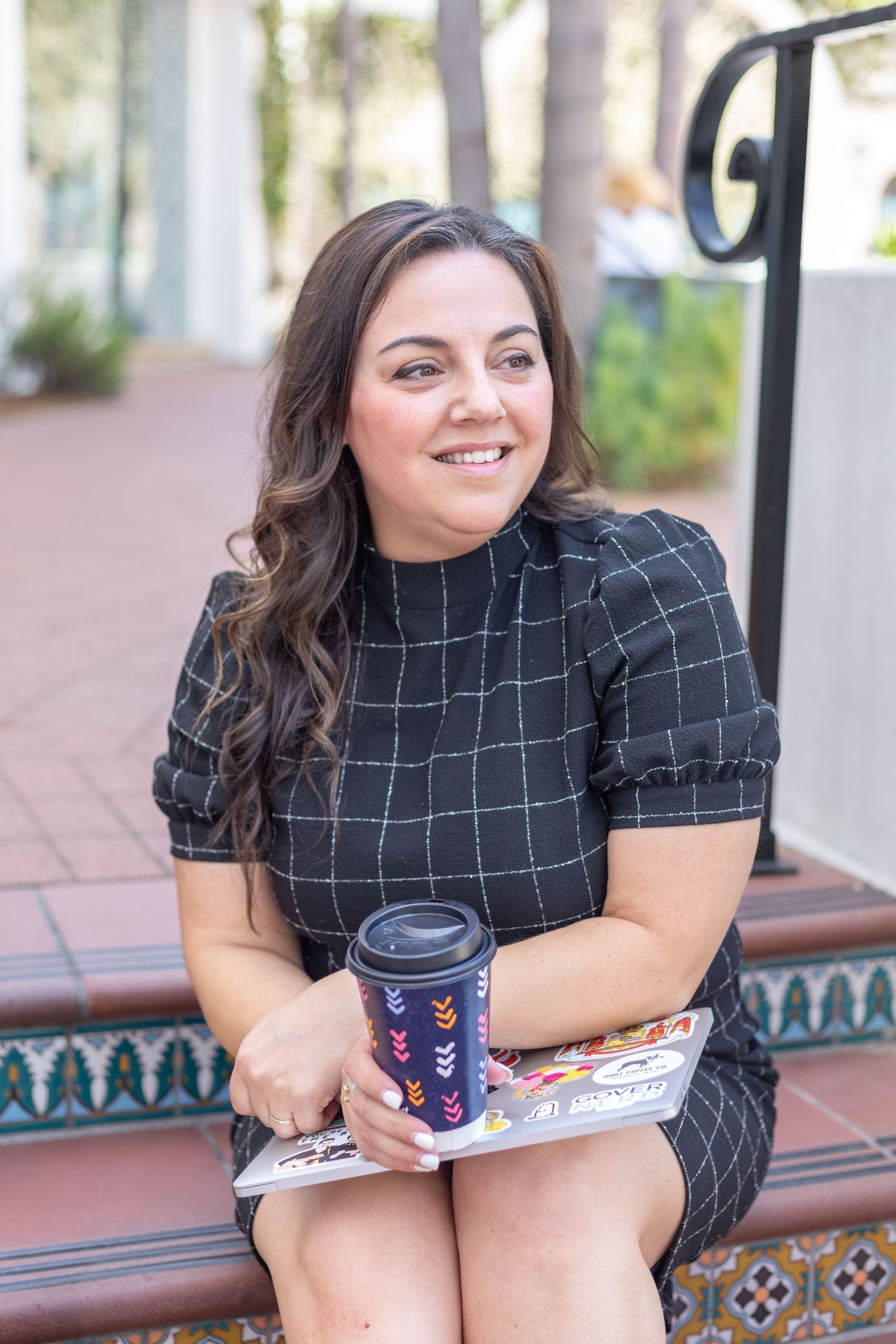 Professional headshot of a person in a business setting, featuring a clean background and natural light.