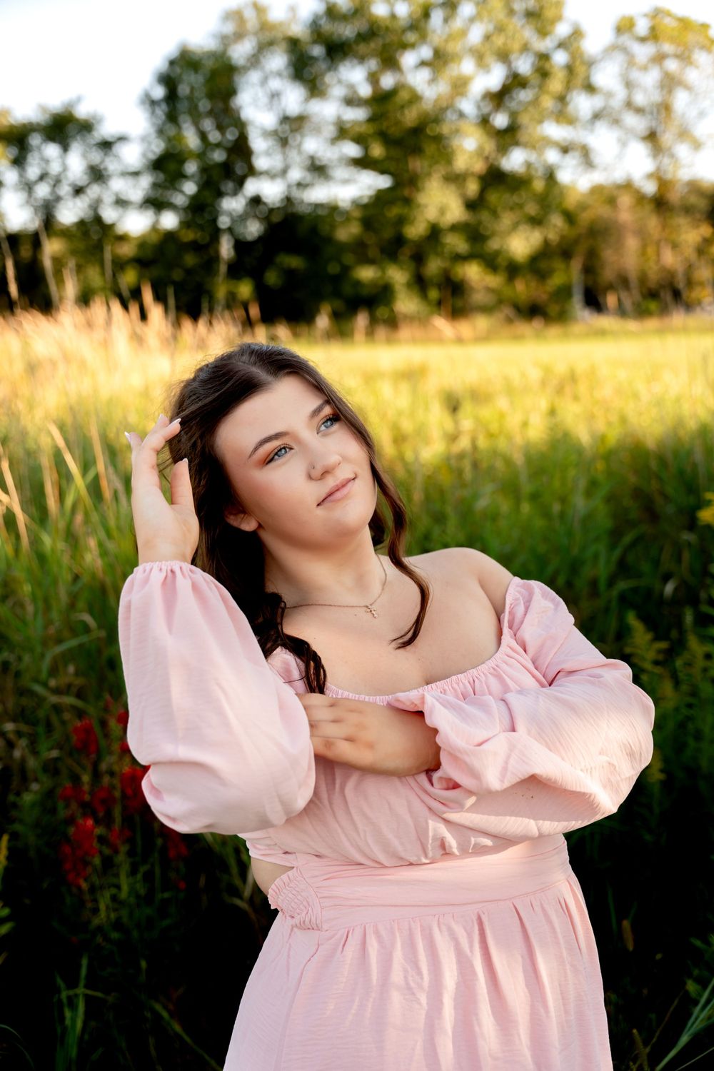 Dreamy outdoor portraits in a pink dress during golden hour.