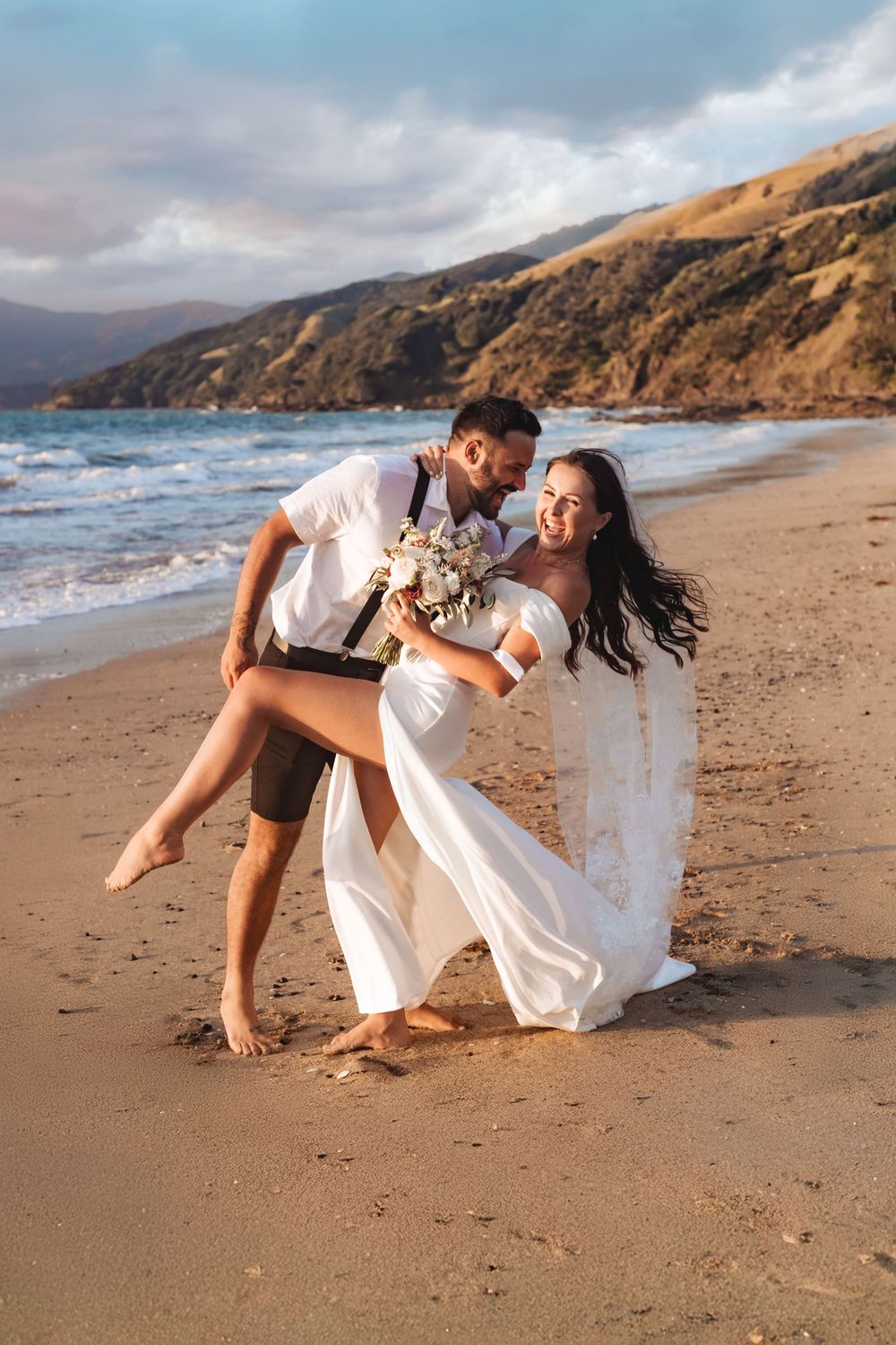 Eric and Jasmin's elopement at Waitete Beach by wedding photographer Jenna James Photography