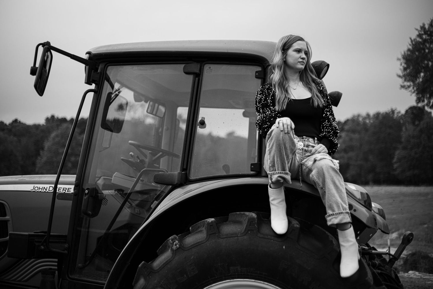 Collection of candid black and white photos with tractors and farm equipment.