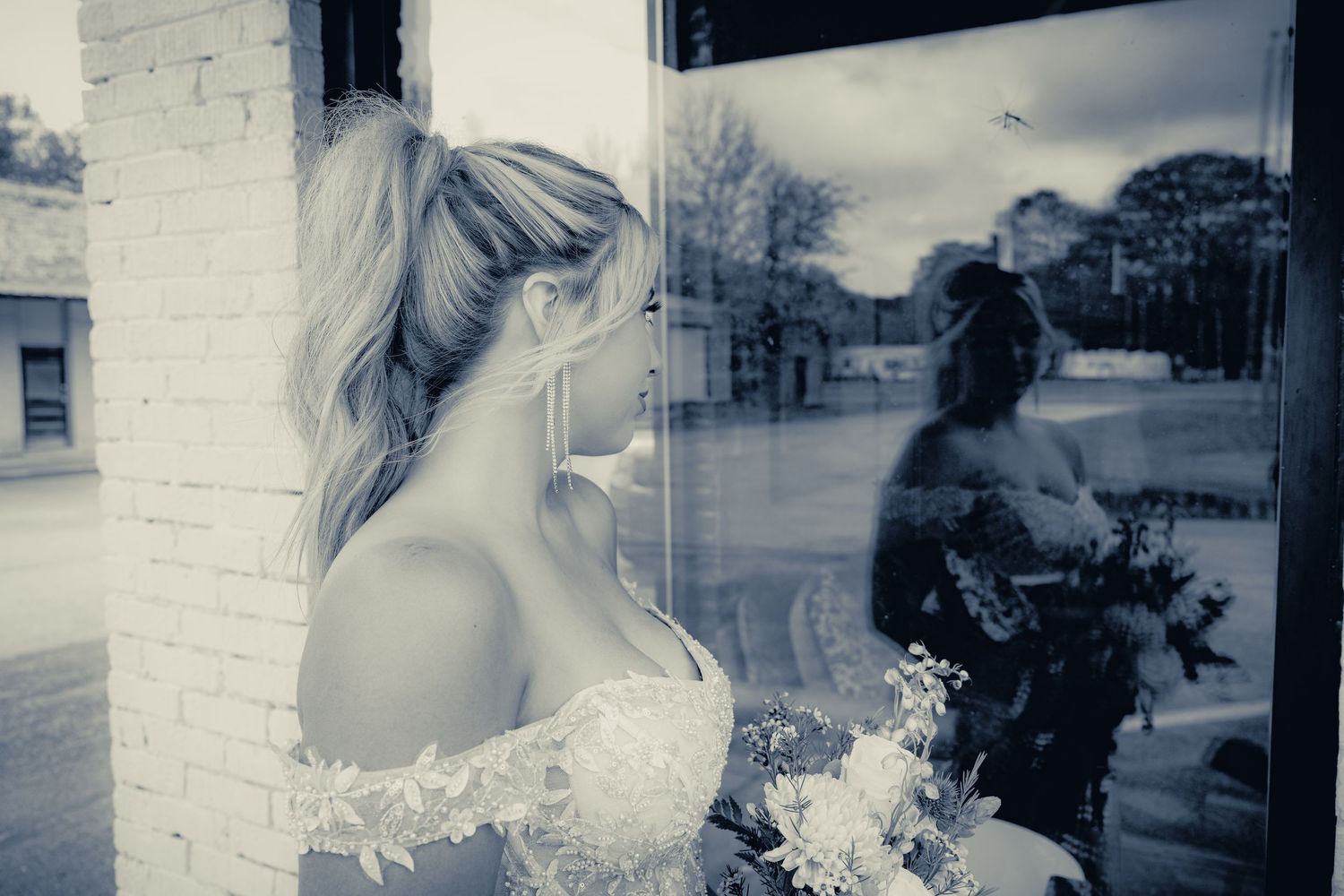 A series of artistic black and white wedding detail shots arranged in a collage format.