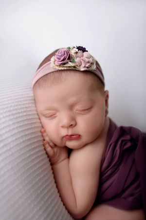 NJ newborn photographer, baby girl in white backdrop in photography studio in Newton nj
