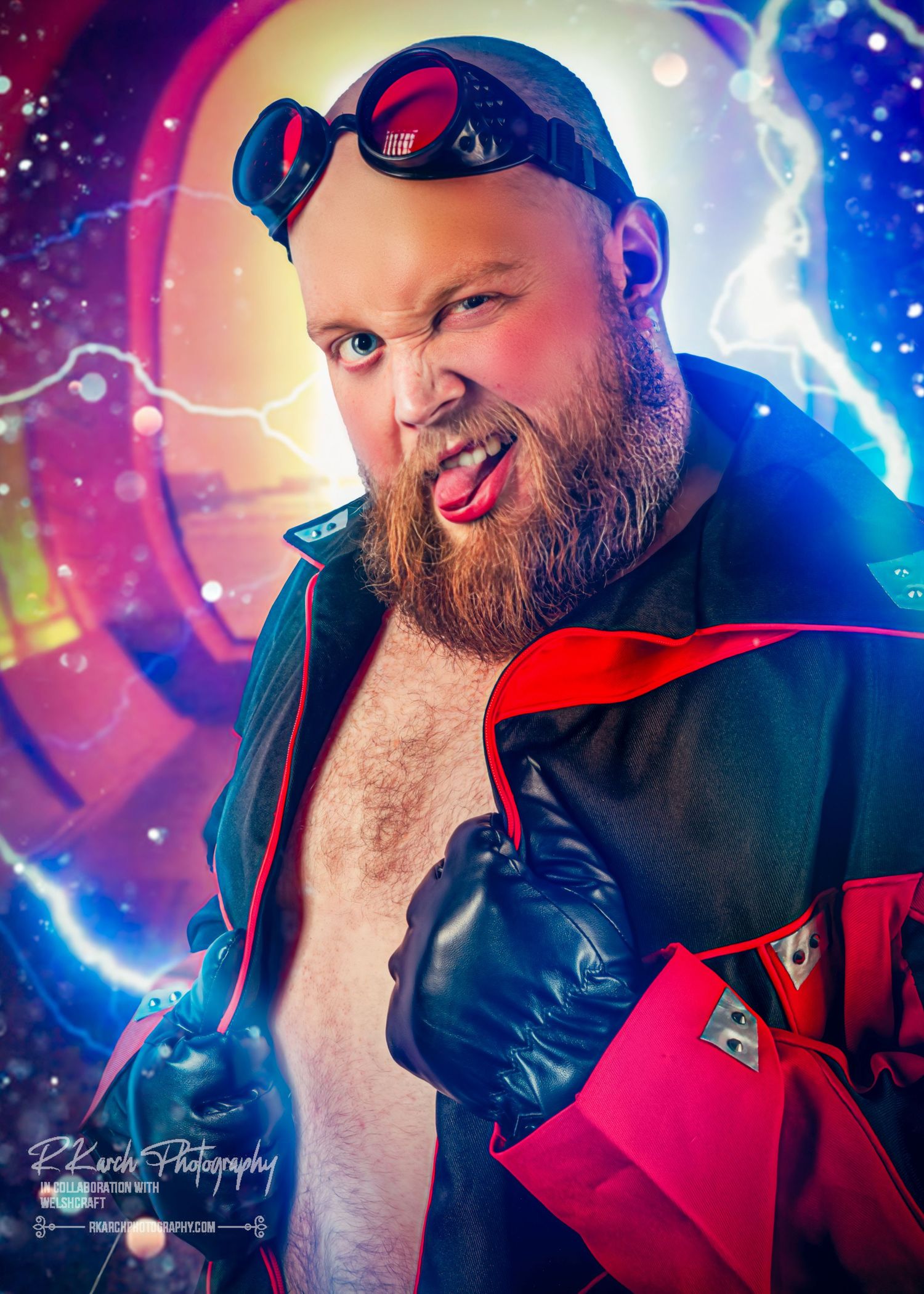 Colorful portrait with vibrant neon lighting showing a bearded man in red and black outfit with sunglasses making dramatic expression.