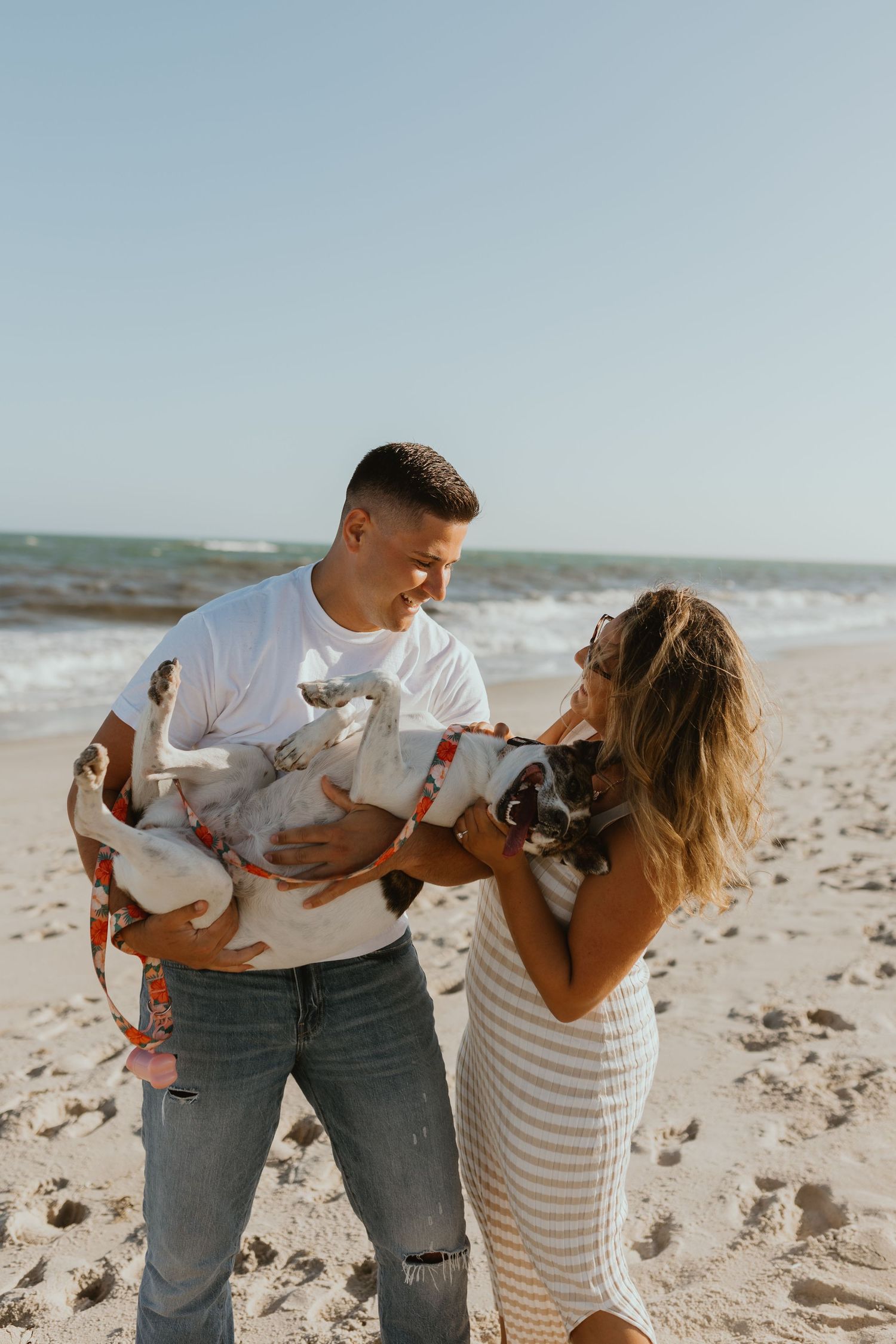 Couple beach engagement photos with a dog on Long Island