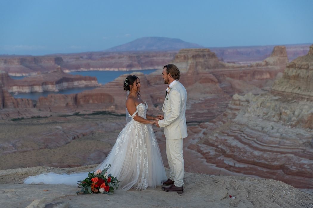 western couple kissing at sunset