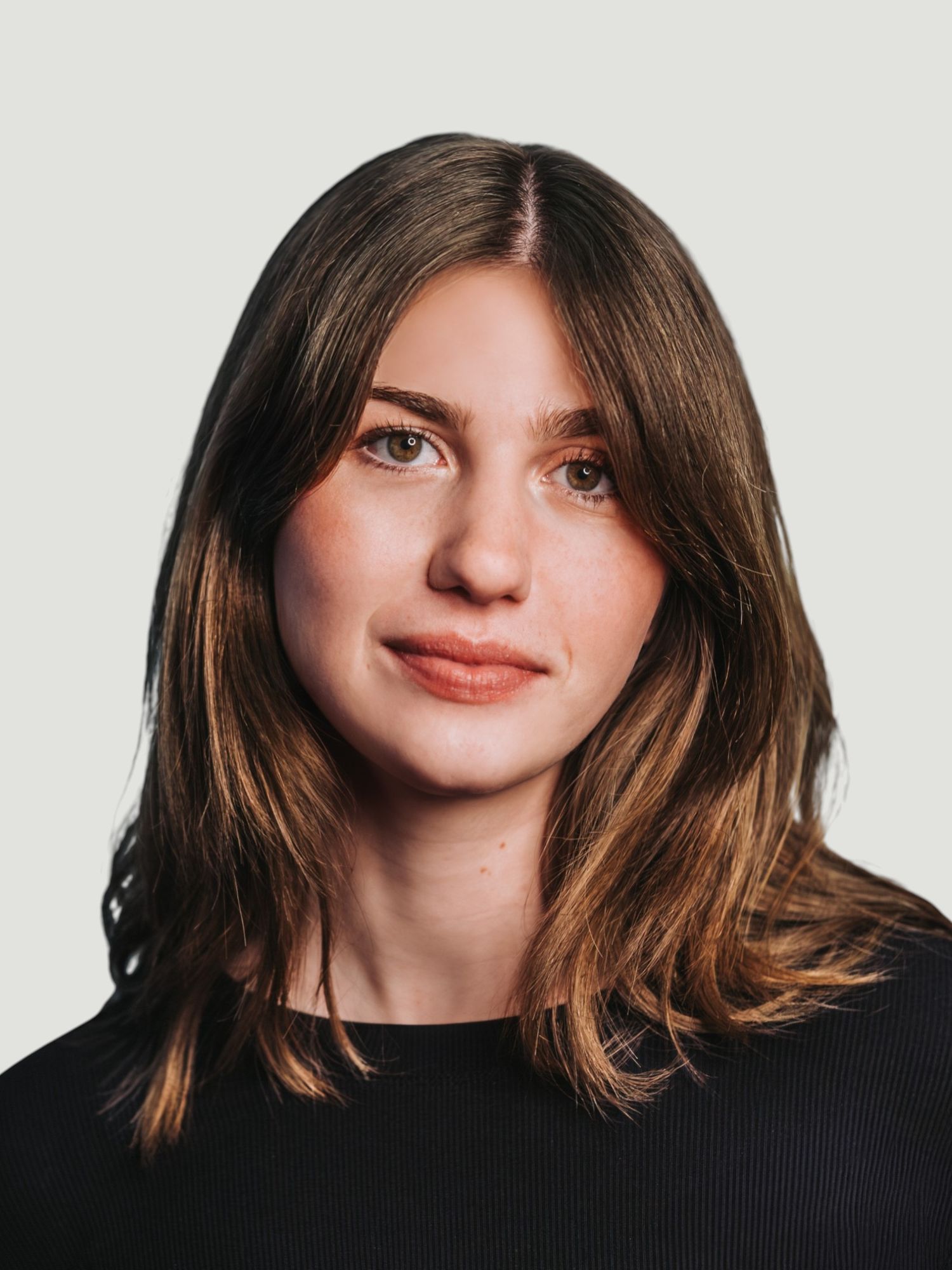 An aspiring model and actress with brown hair and dark clothing is shown in a series of profile poses against a light background.