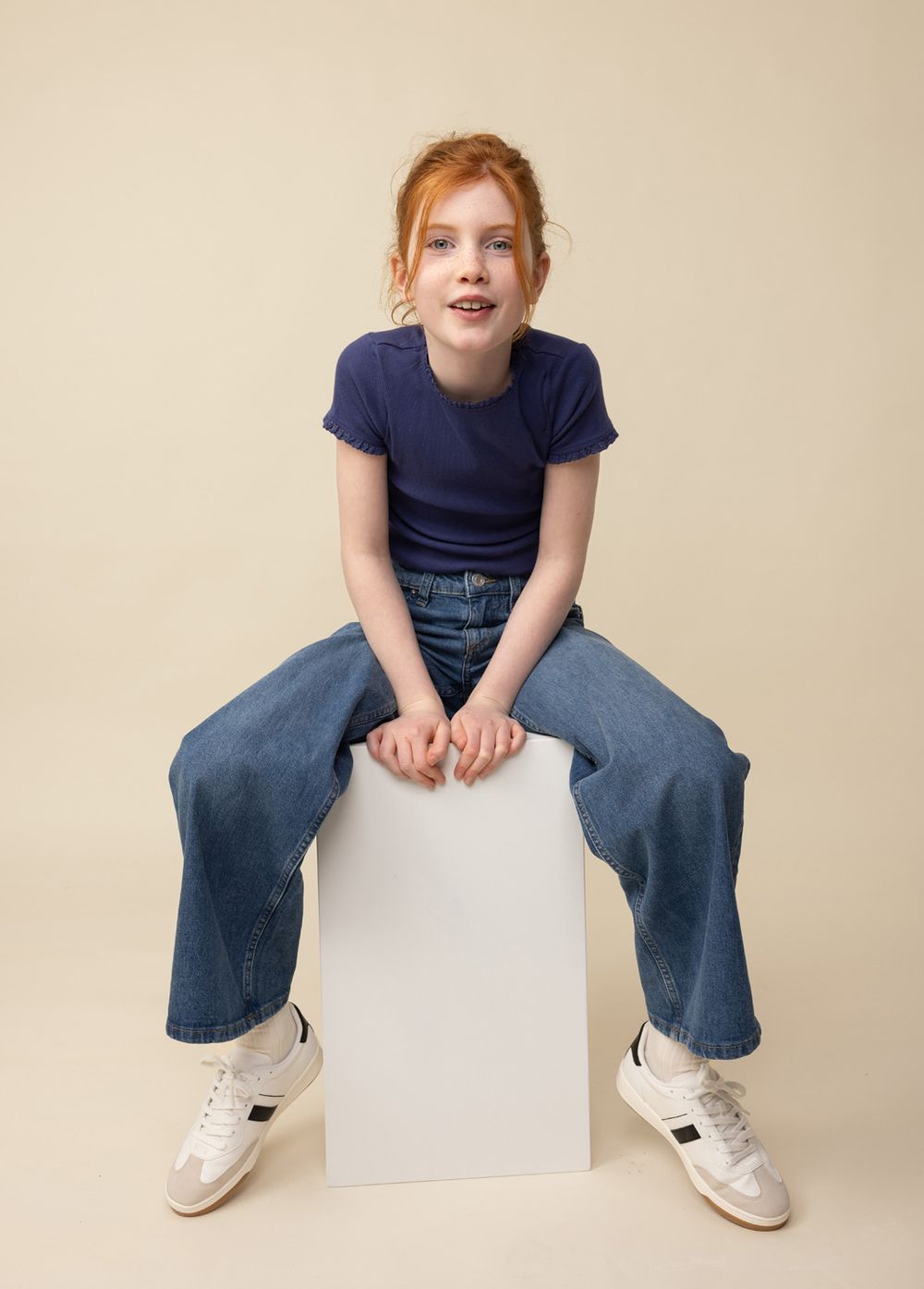 Child model full length portrait of a young girl, photographed at Abigail Stewart Photography studio near Milton Keynes