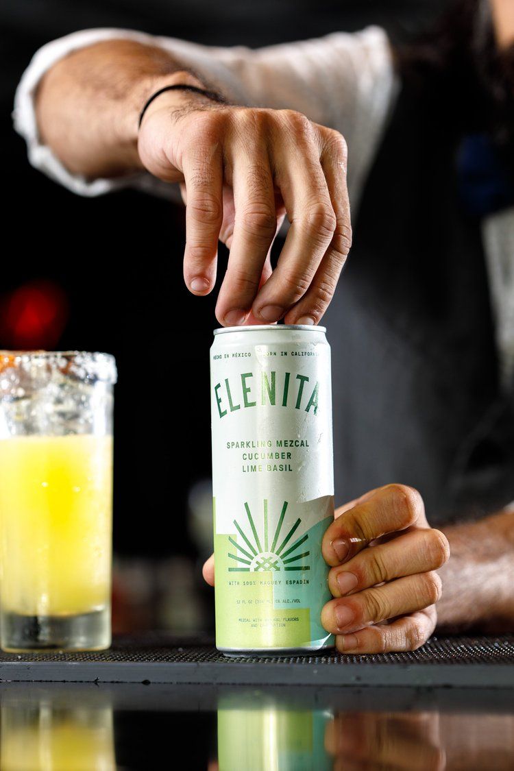 Series of shots showing cocktail preparation using Celestial brand spirits on dark bar counter.