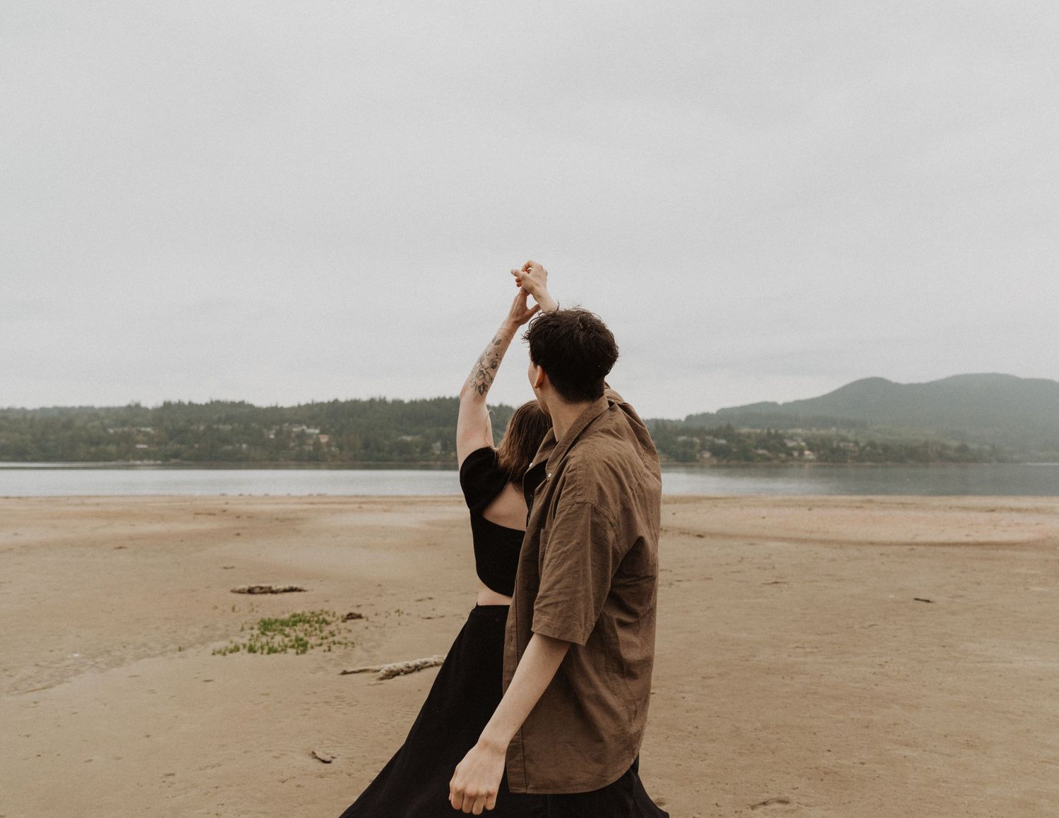 Couple dancing together on the beach during an Abbotsford engagement photography session.
Location: Honeymoon Bay, Sunshine Coast.
