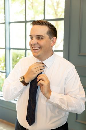Iowa wedding photography. Posing ideas for groom getting ready photos at the Monroe venue in West Des Moines, Iowa.