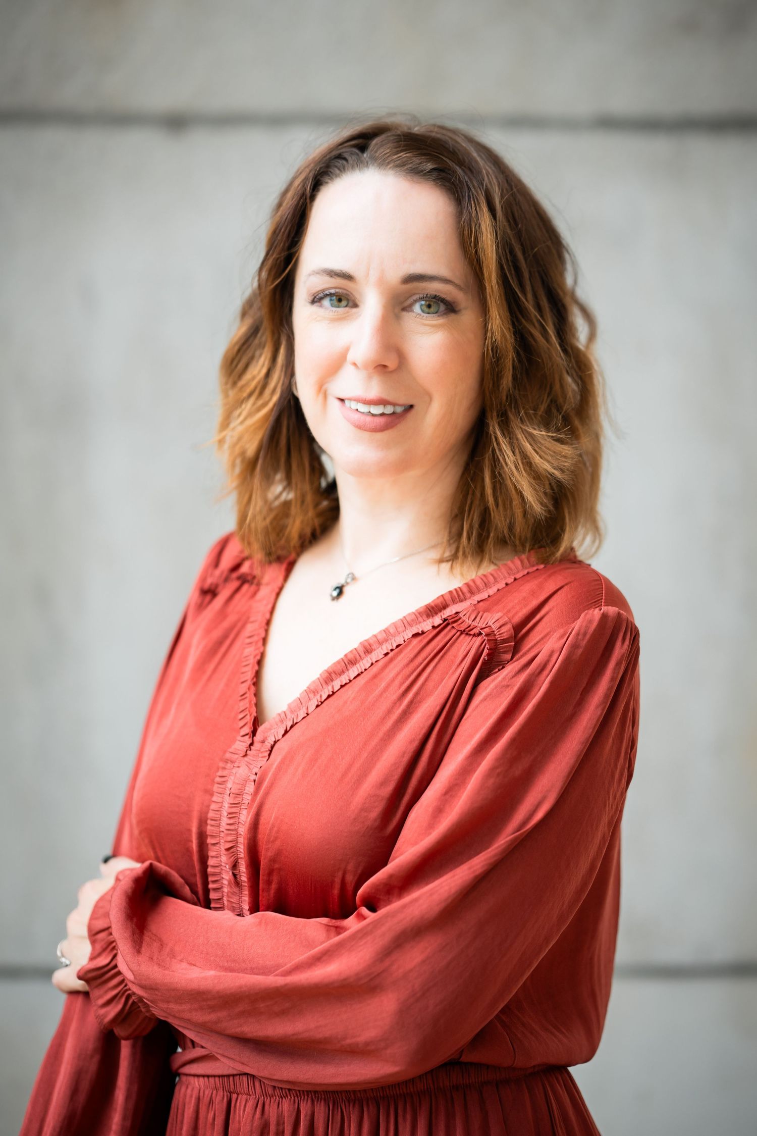 Professional portrait series showing a person in a red top against a light gray background.