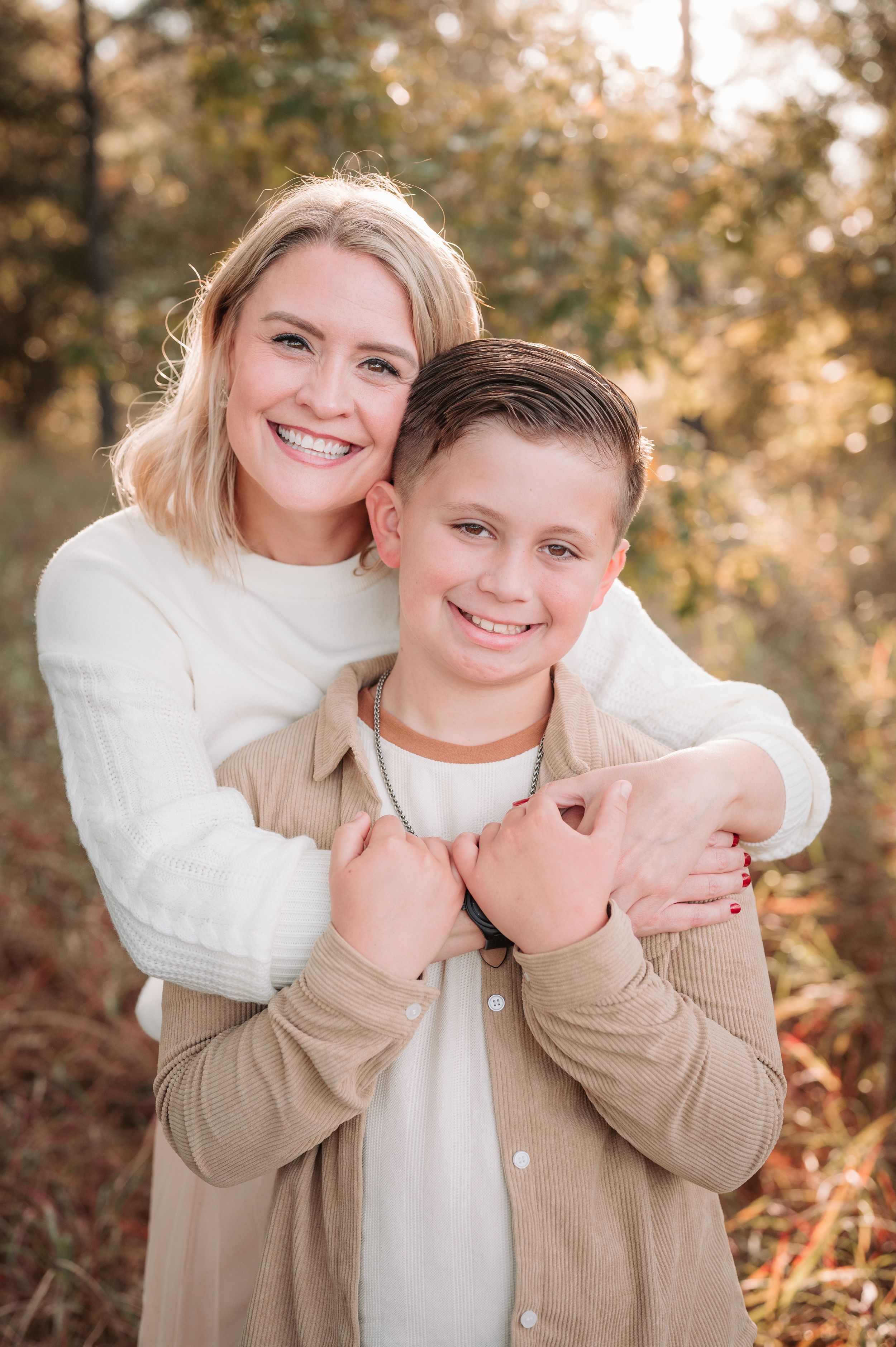 Candid moments captured between two people wearing neutral colors during a golden hour photoshoot.