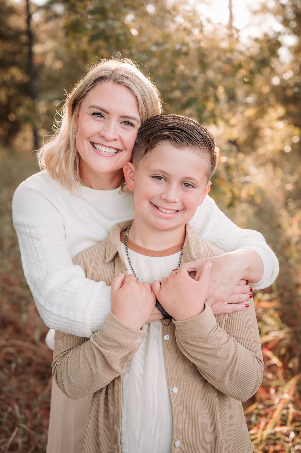Candid moments captured between two people wearing neutral colors during a golden hour photoshoot.