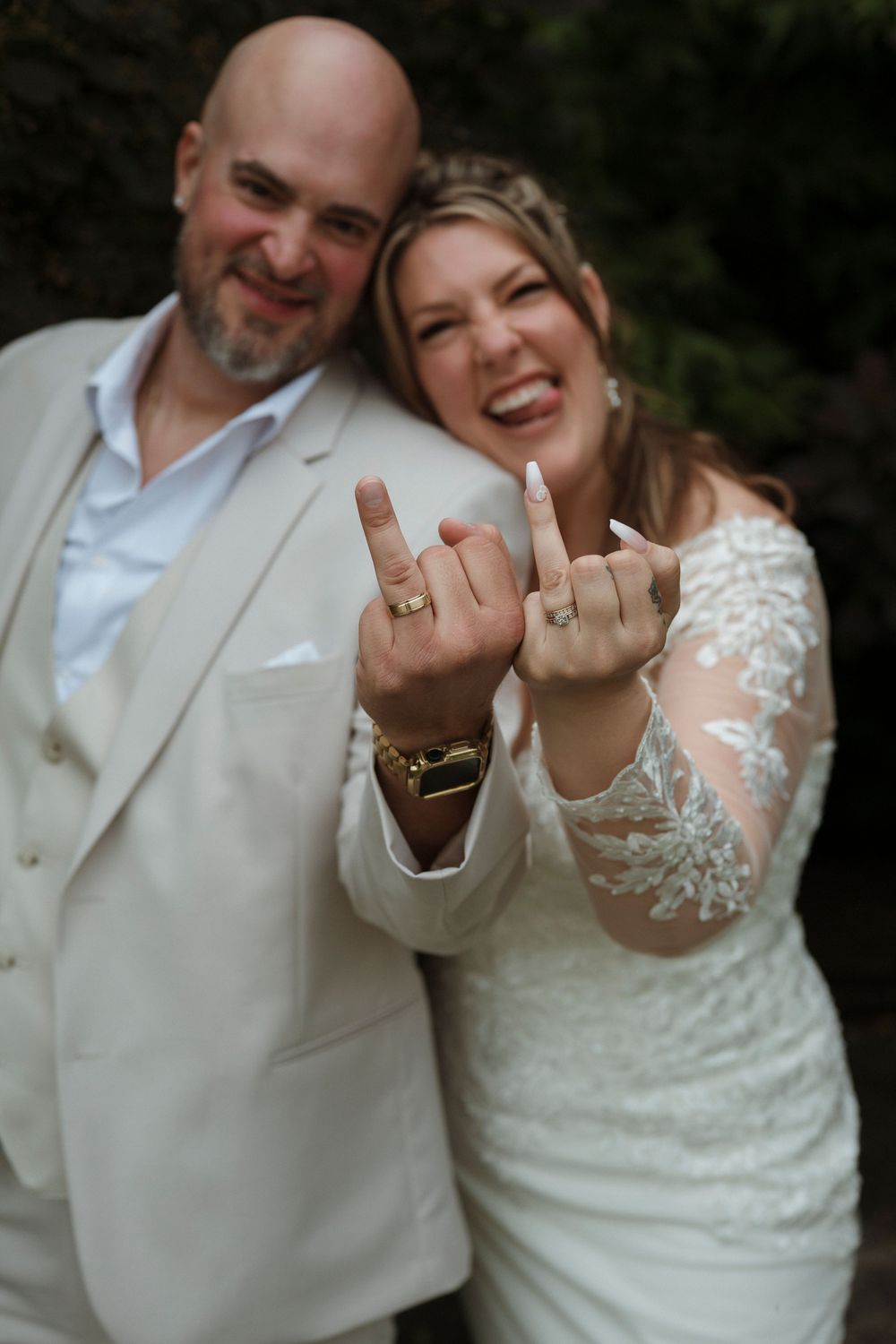 Newlywed couple in white showing off their wedding rings in a series of playful photos together.