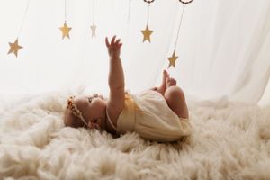 Stars and decorative elements arranged in a whimsical pattern against a light background.