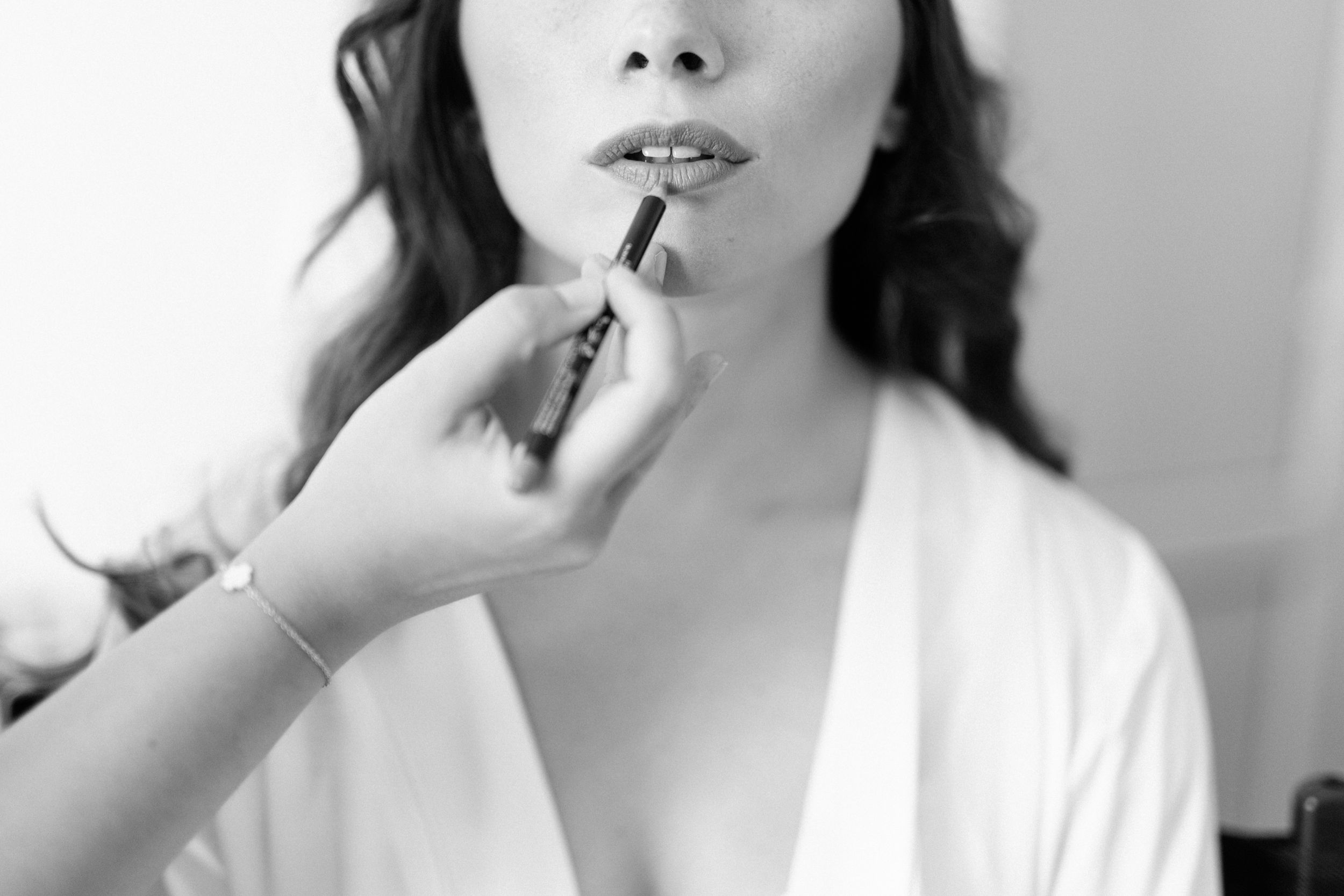 Black and white portrait series showing someone in a white top against a light background.