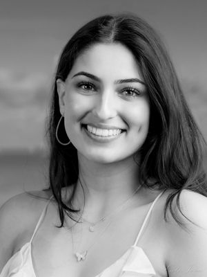 Black and white portrait sequence showing woman in white top displaying various expressions and angles.