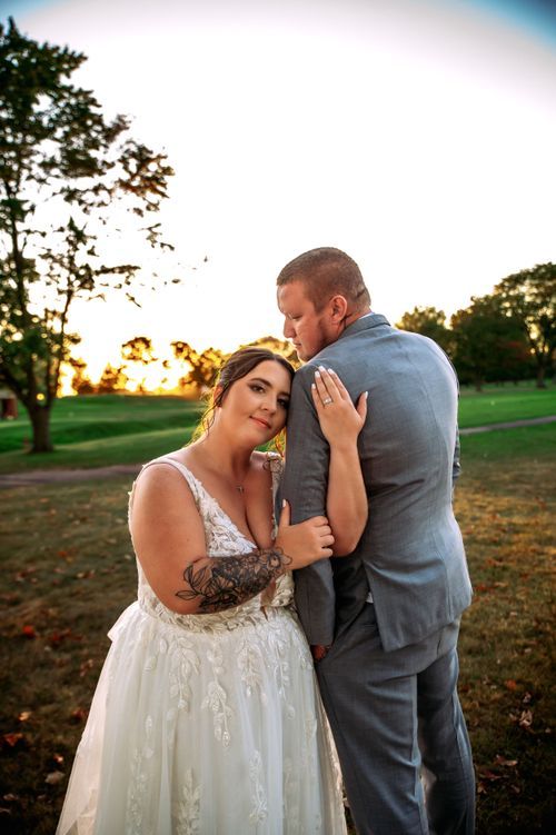 Bride and groom embracing during their wedding portraits in Northwest Ohio.