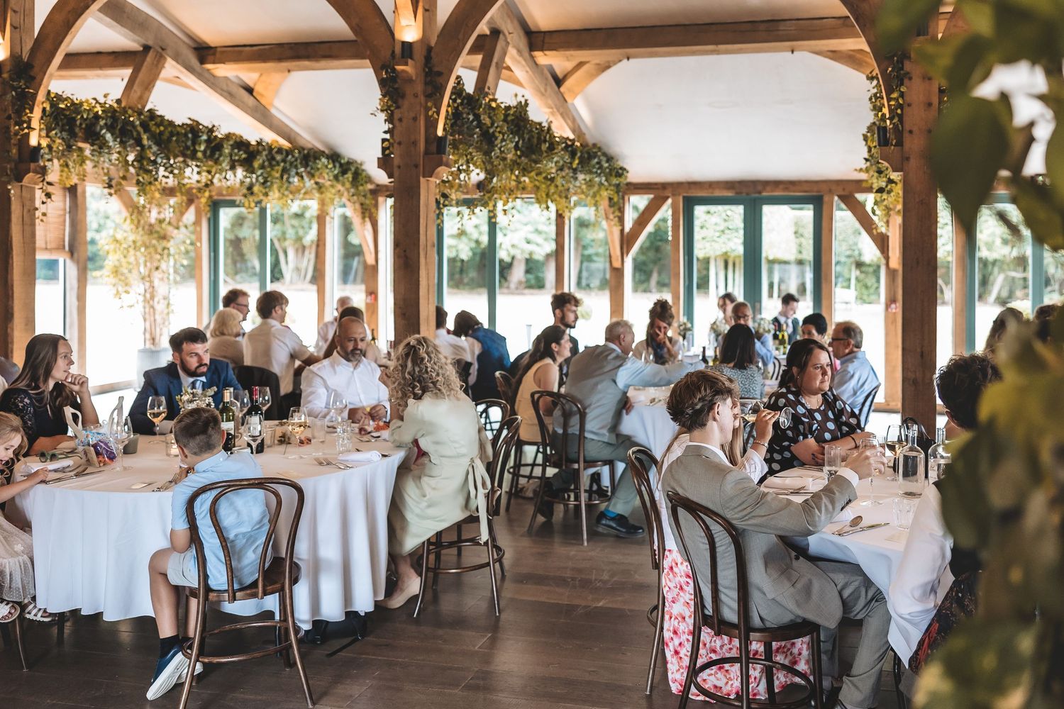 Wedding guests enjoying the wedding breakfast at Hazel Gap Barn