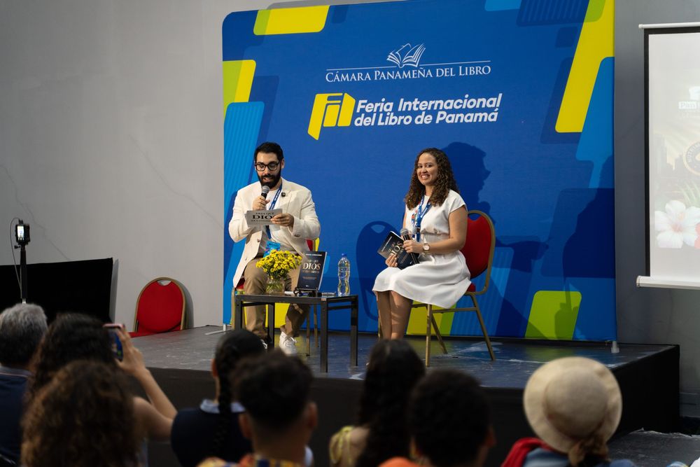 Two speakers on stage at Feria Internacional del Libro de Panama book fair event.