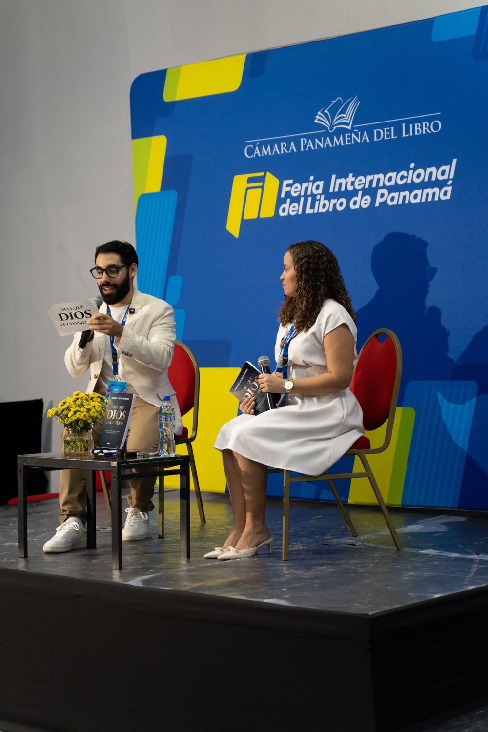 Two speakers on stage at Feria Internacional del Libro de Panama book fair event.