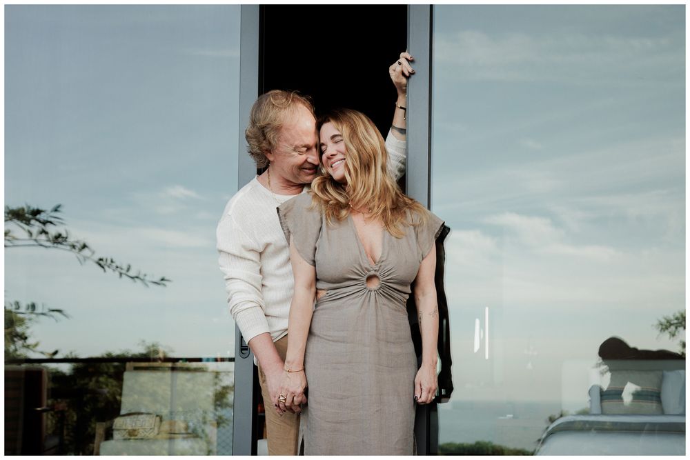 Couples Photo Session at One & Only Mandarina Resort with an engaged couple holding hands and sharing a joyful moment outdoors.