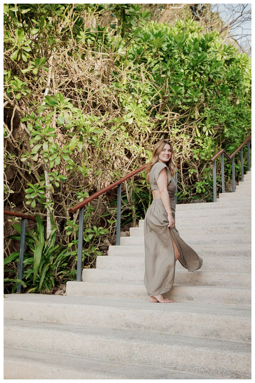 Luxury Couple Photography at One & Only Mandarina Resort featuring a bride-to-be walking through lush tropical gardens.