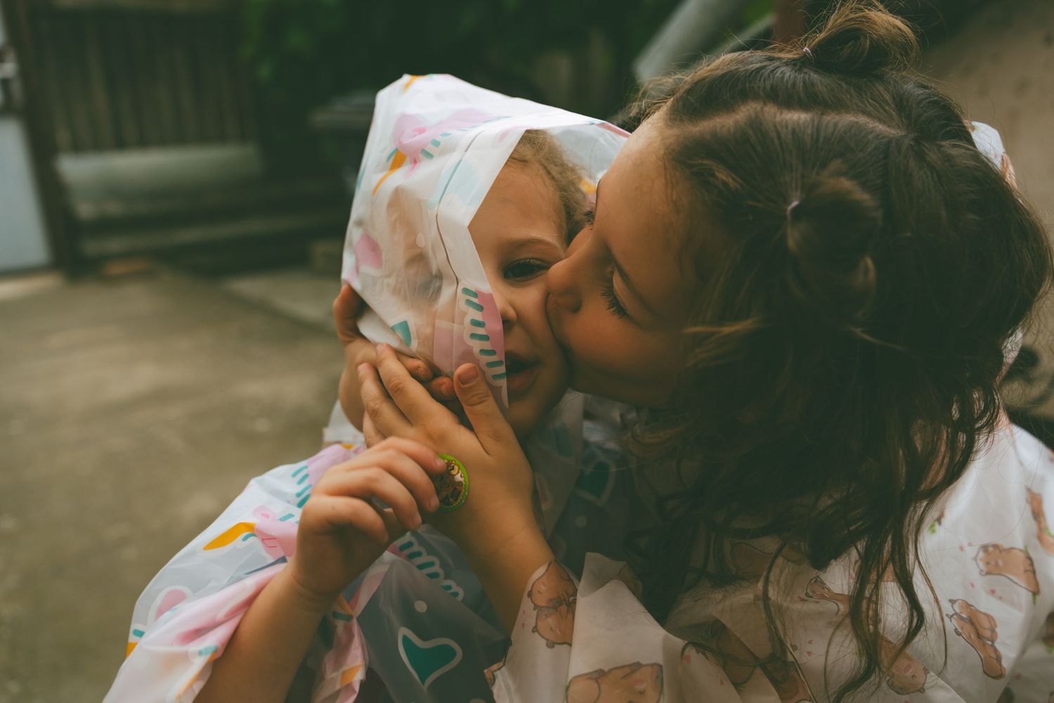 film style vintage photography style kids raincoat kiss