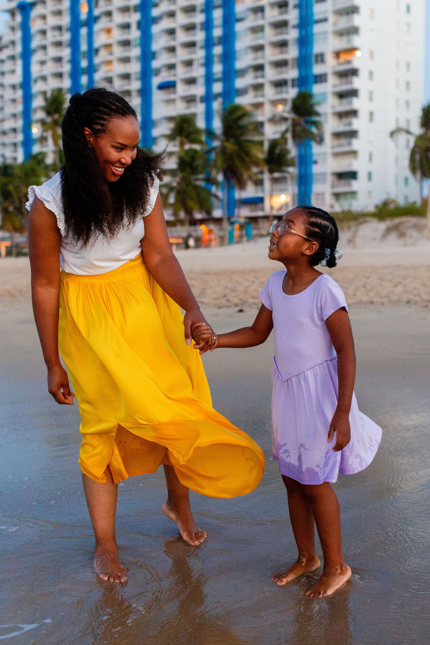 Mother and daughter on the beach in Isla Verde, Carolina, Puerto Rico.
