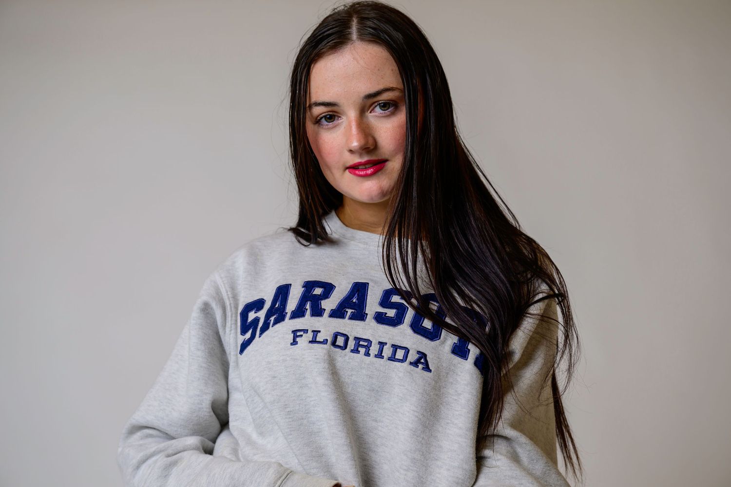 Creative personal branding portrait of a young woman in casual attire