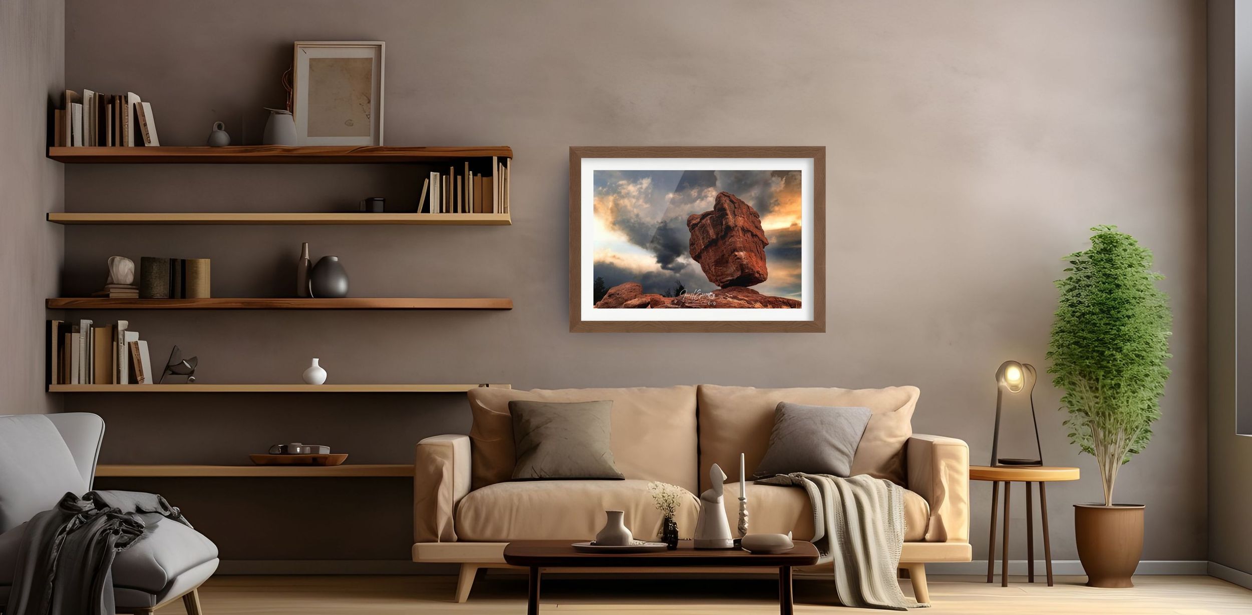 Framed artwork of a Rock Formation with dramatic clouds displayed above a beige sofa in a modern living room.