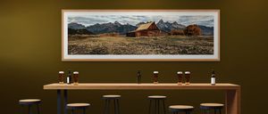 Framed Wyoming landscape fine art photography displayed in a luxury living room interior