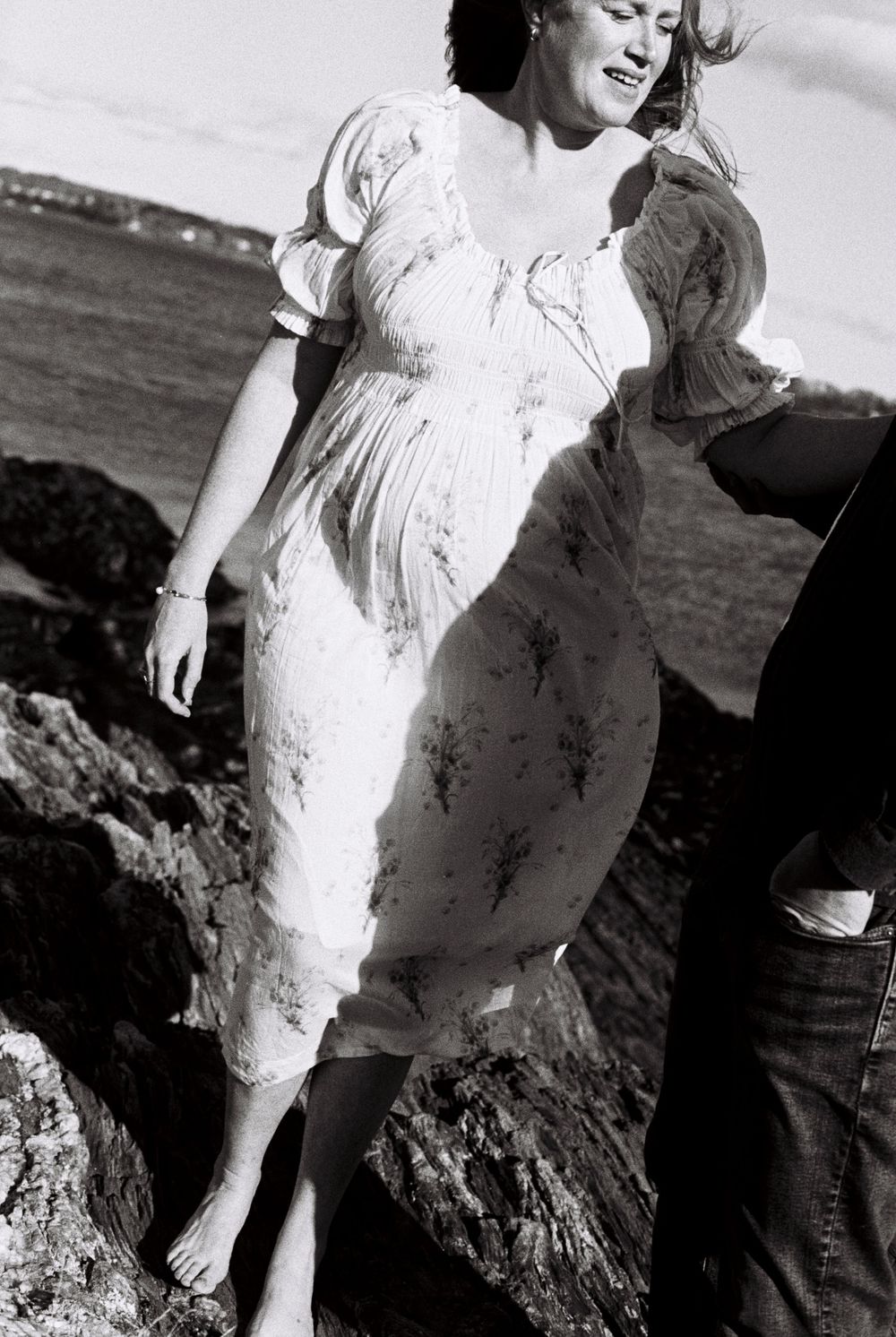 Portrait of a mother in black and white as she expects her first child during a sunny November maternity photo shoot in South Portland.
