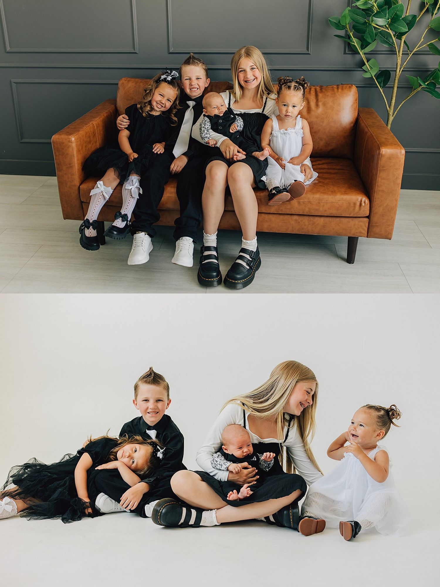 A young mother sits on a brown leather sofa with four children in black and white outfits in a studio portrait.