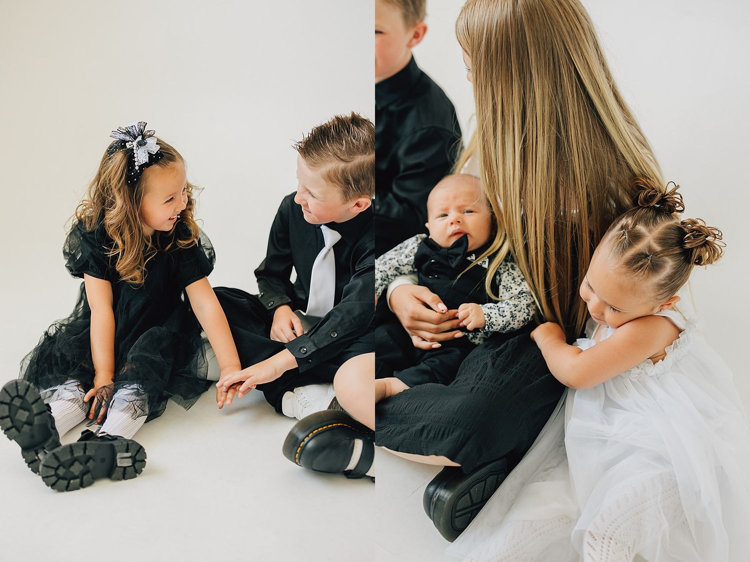 A woman in black sits on the floor with four young children dressed in black and white formal attire.