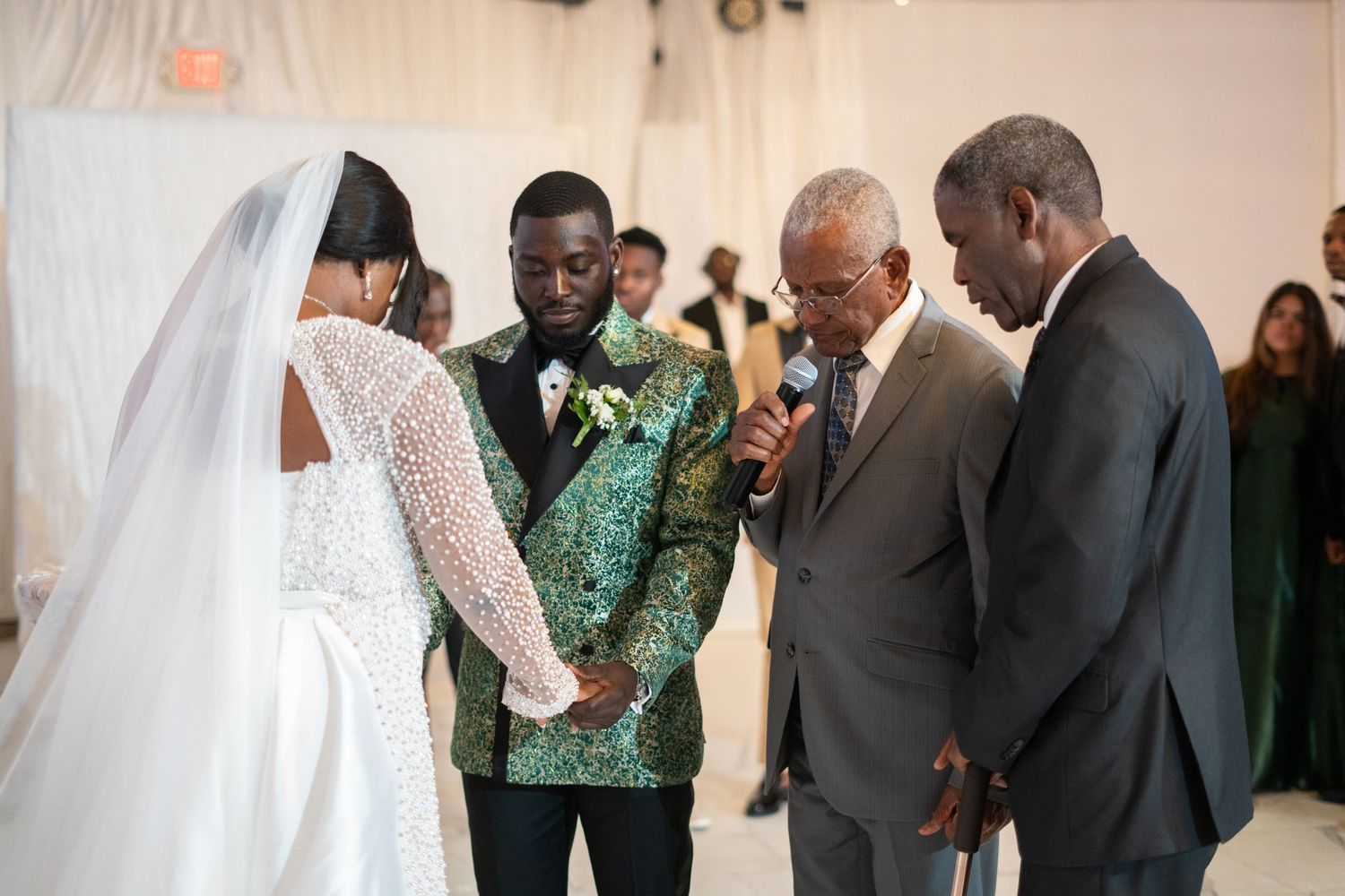 Nigerian white wedding ceremony bride and groom exchange vows Orlando