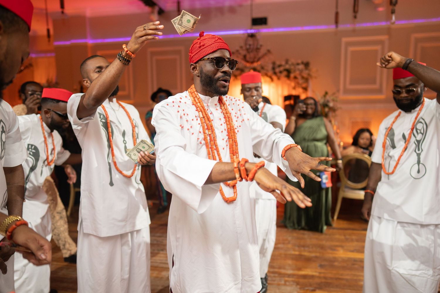 Igbo groom traditional attire coral beads Nigerian wedding reception Orlando Florida
