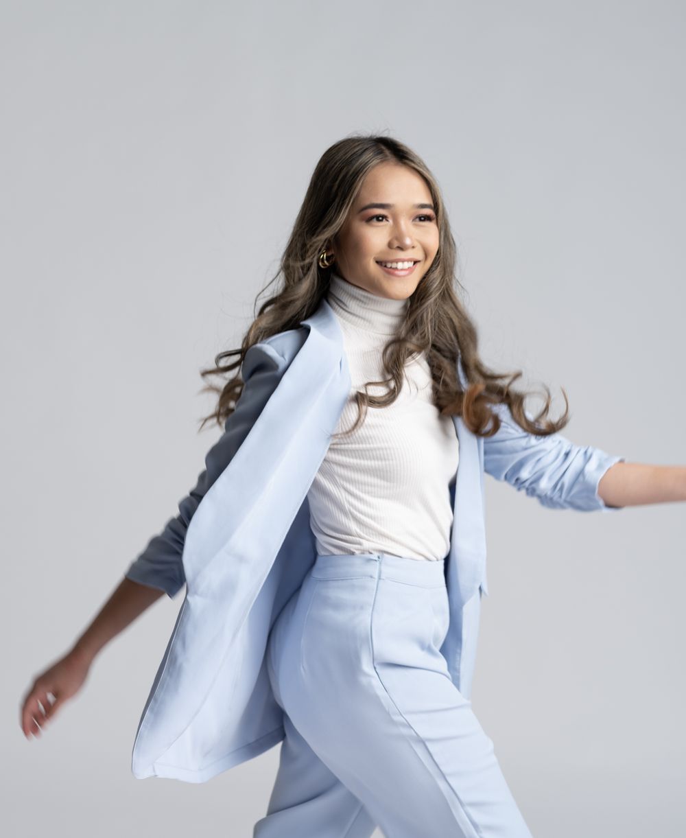 Professional branding portrait of a businesswoman in a baby blue blazer photographed by Gerardo & Co. in Minneapolis.