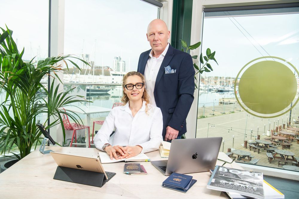 Commercial portrait of Charlotte Cansick and Robert Lankester of Orcas Travel in their offices, Suffolk.