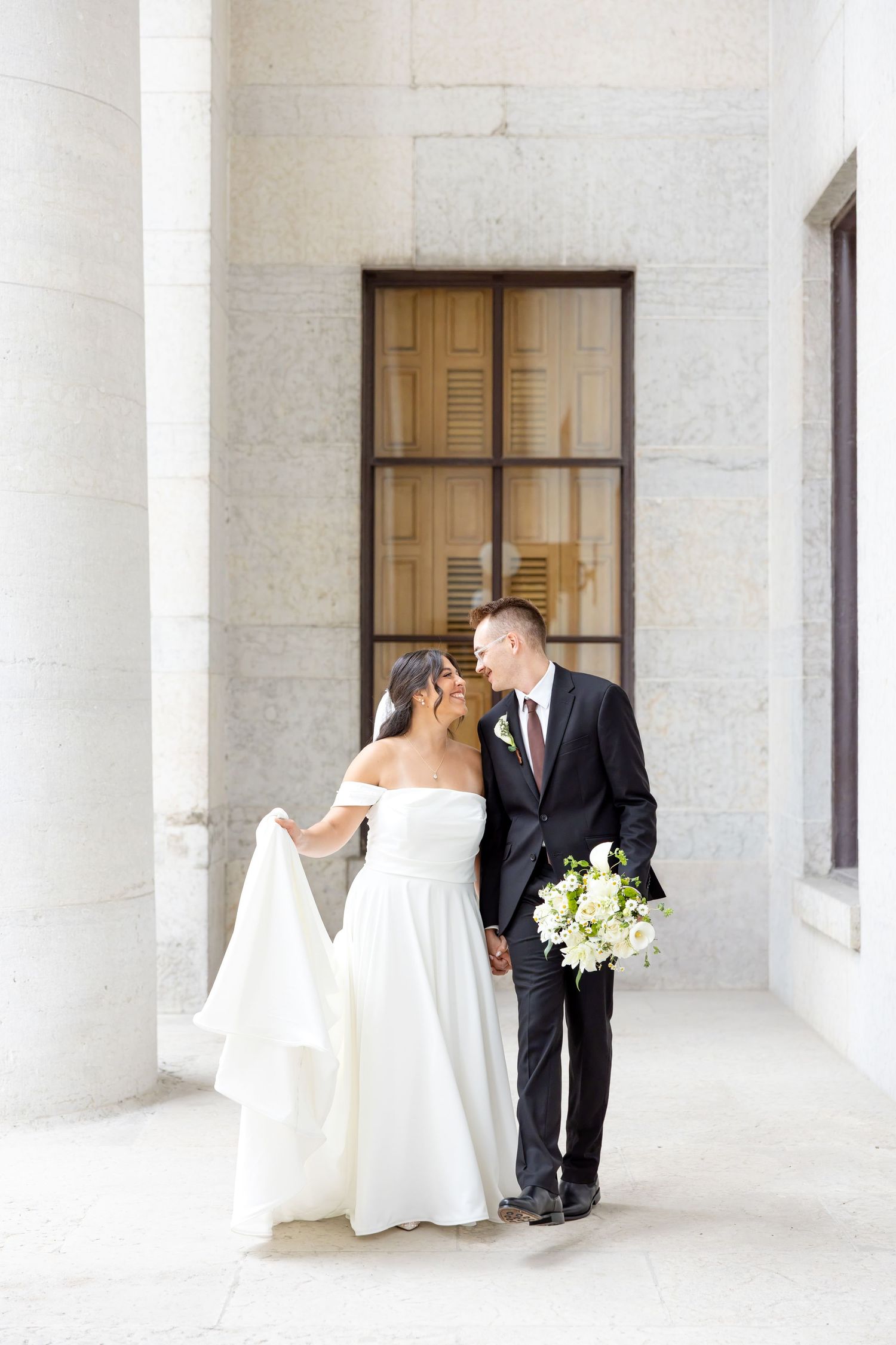 Bride and groom celebrating their Flat 51 wedding in downtown Columbus, Ohio, captured with timeless, light and airy wedding photography.