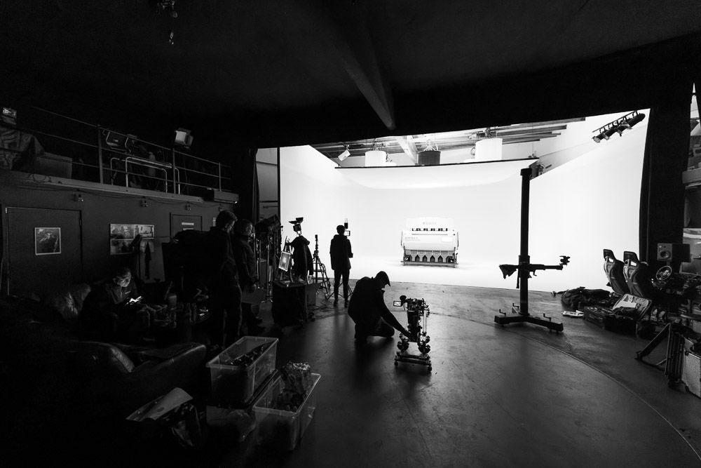 Black-and-white photo taken during an industrial product photo shoot at a studio.