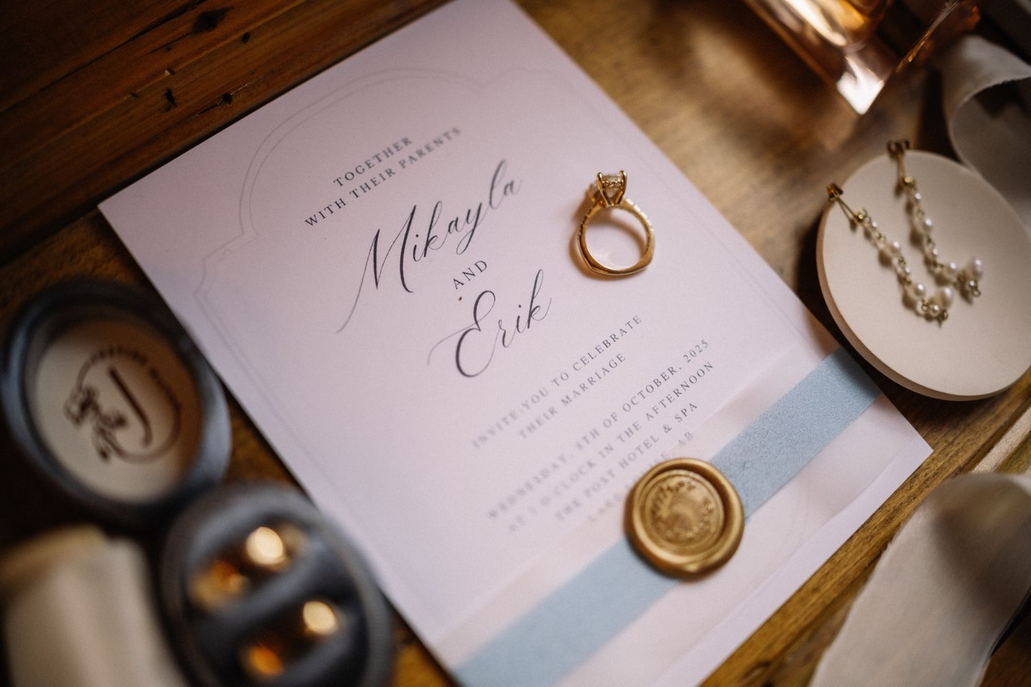 Mikayla and Erik's wax-sealed wedding invitation and rings, Lake Louise