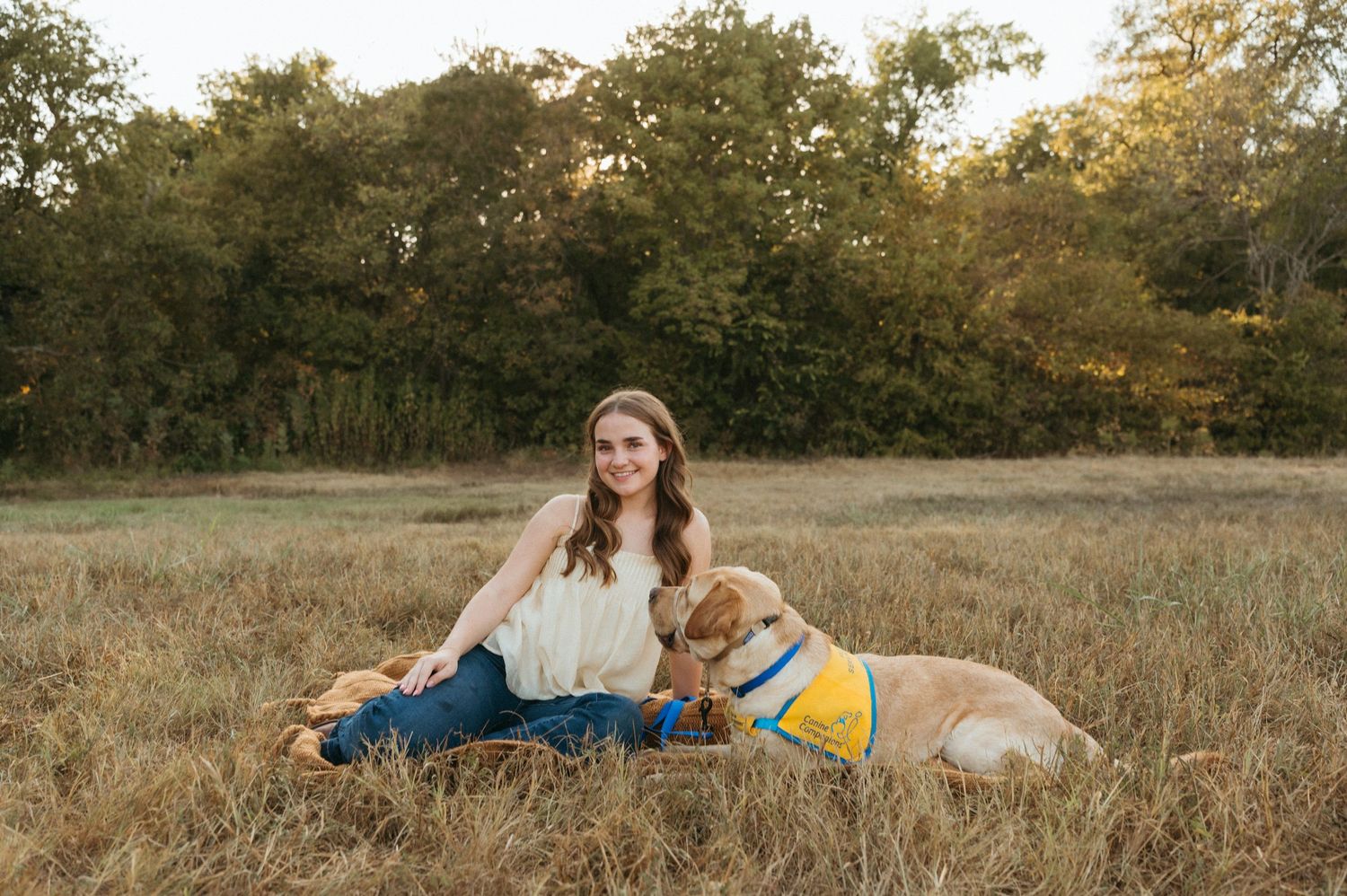 Allen Texas senior pictures featuring a meaningful high school activity and Canine Companion