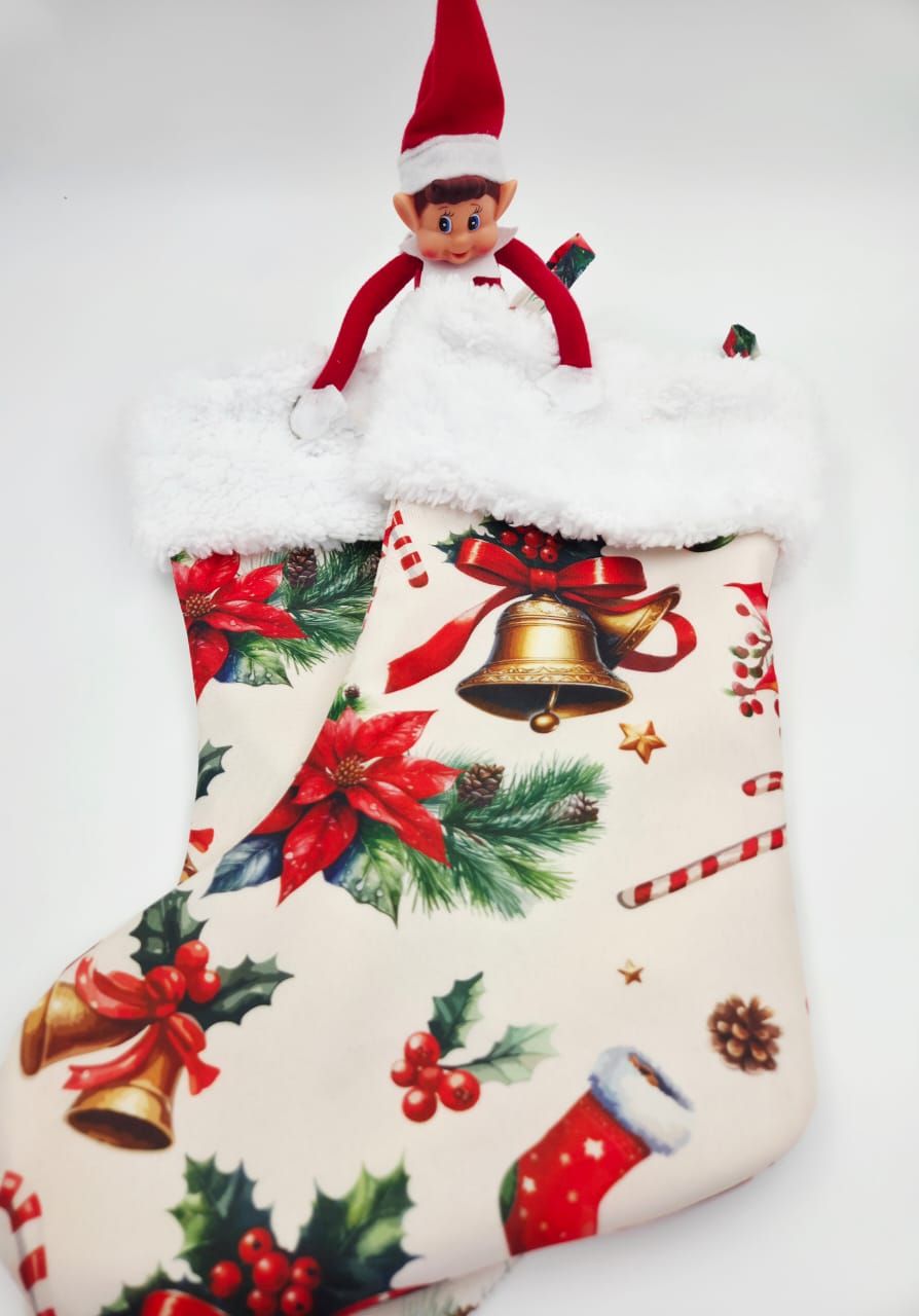Christmas stocking with festive poinsettia and bell print, featuring an Elf on the Shelf peeking out from the white fluffy trim.