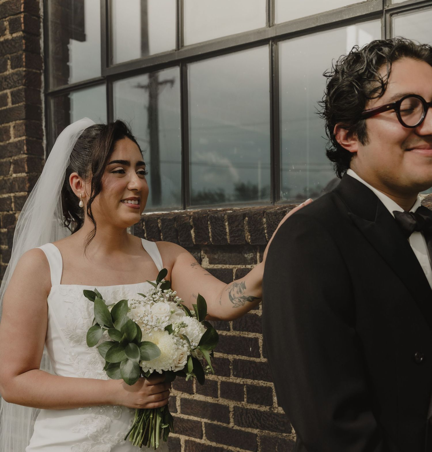 Bride and groom sharing a first look at their intimate Nashville wedding at The Maxwell Room.