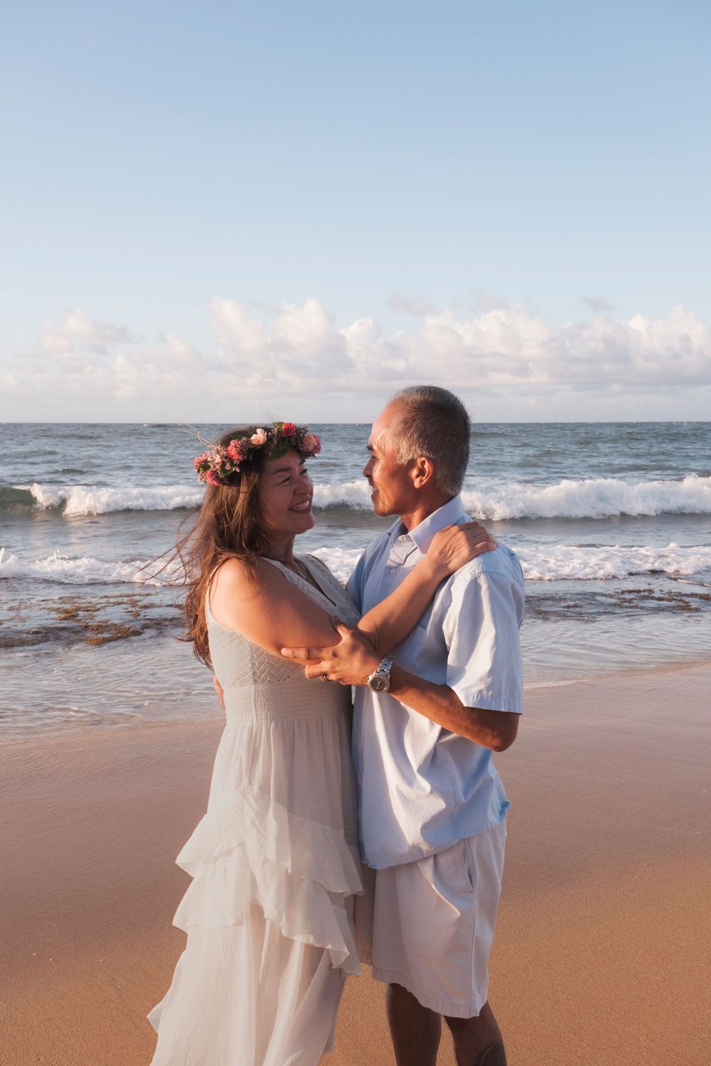 Intimate couple portrait at sunset on the shoreline of North Shore Oahu.