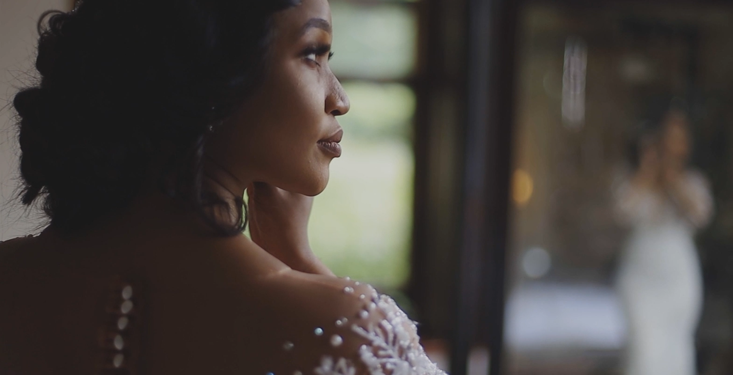 Bride having her hair and makeup completed before the wedding ceremony.