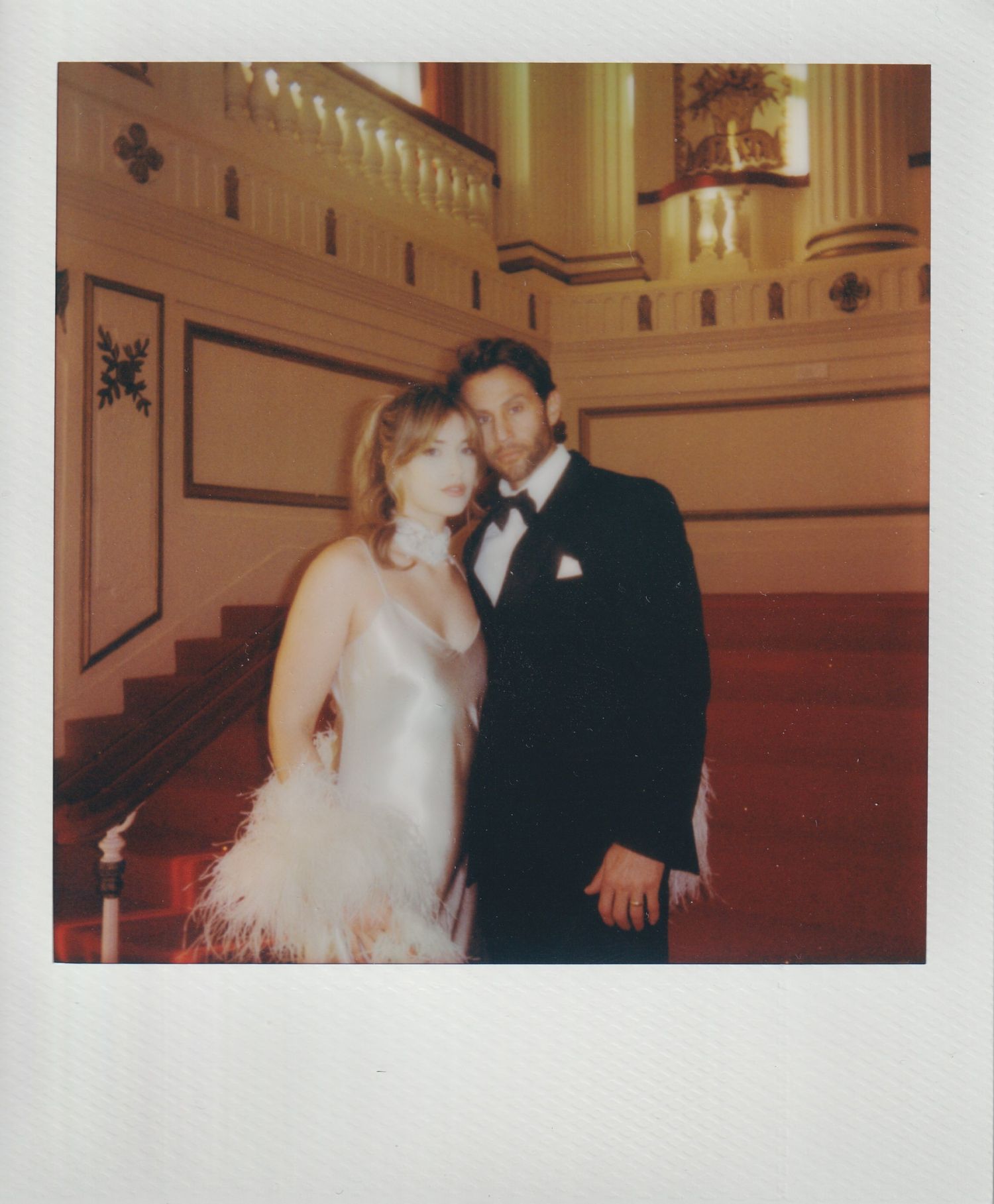 Luxury couple enjoying portraits at the St. Louis Symphony after their St. Louis wedding.